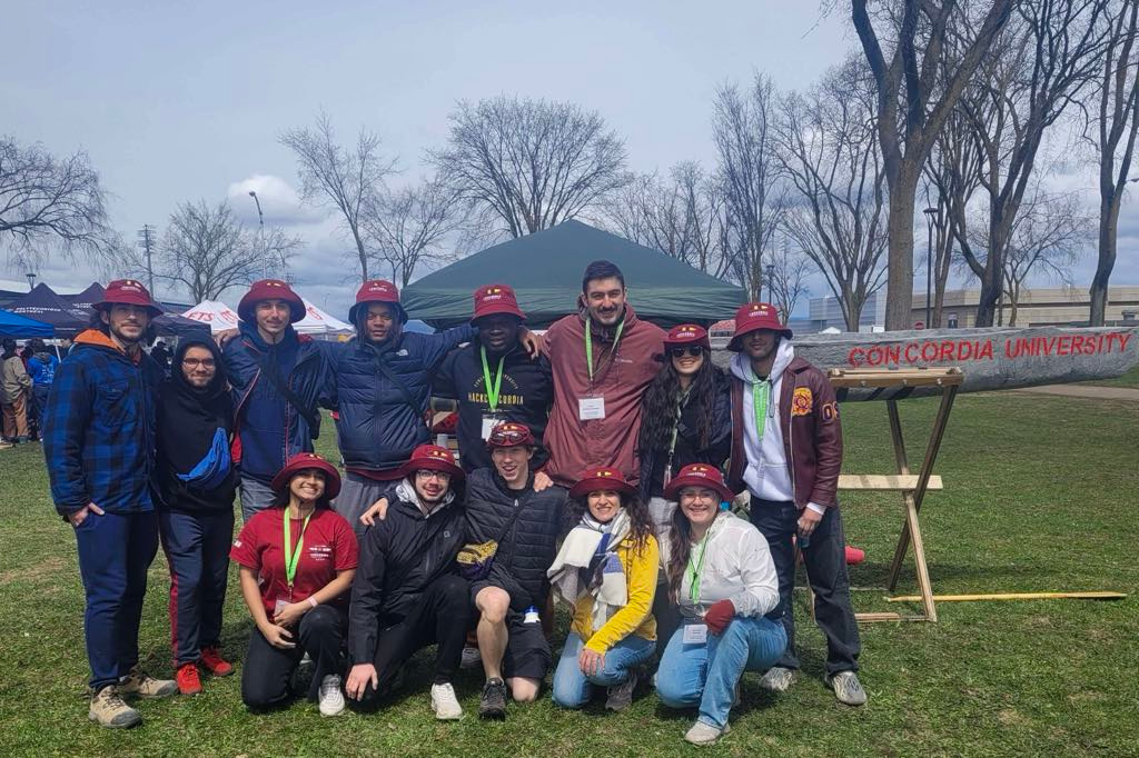 The Concordia Concrete Canoe team with the finished canoe on its trailer